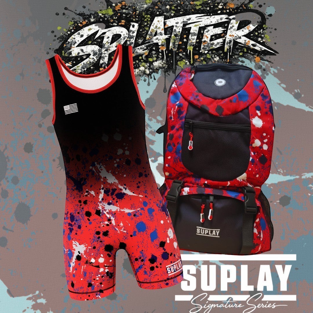 Suplay.com Signature Series wrestling singlet and matching gear bag with red, blue, and black paint splatter design.